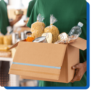 Person holding a box of healthy food